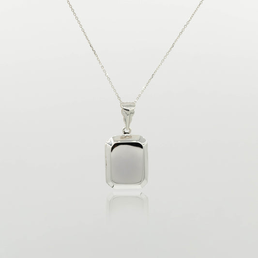 rectangular silver locket on a fine silver chain with a white background
