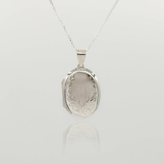 round oval large sterling silver locket with delicate design