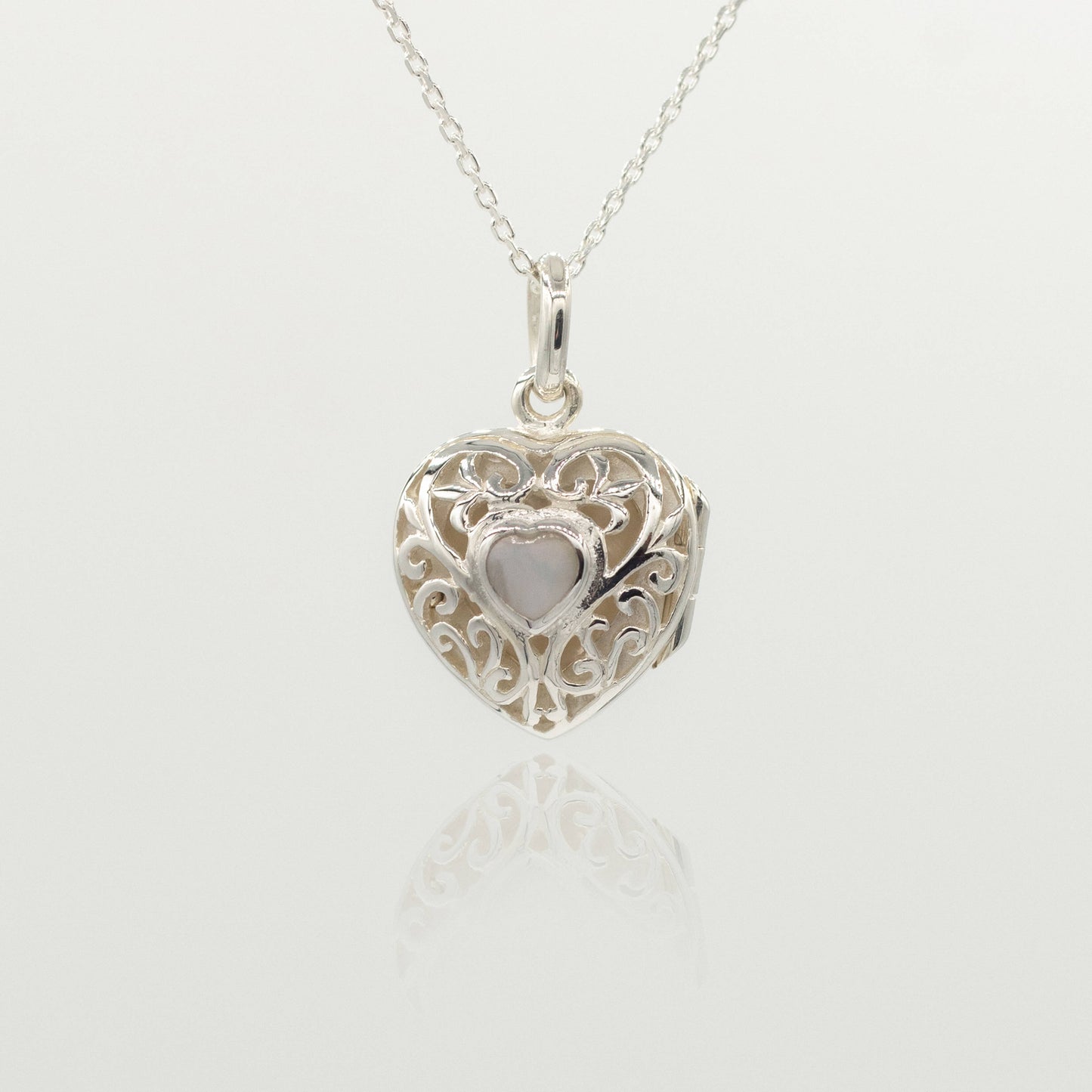 sterling silver heart locket with white heart inside
