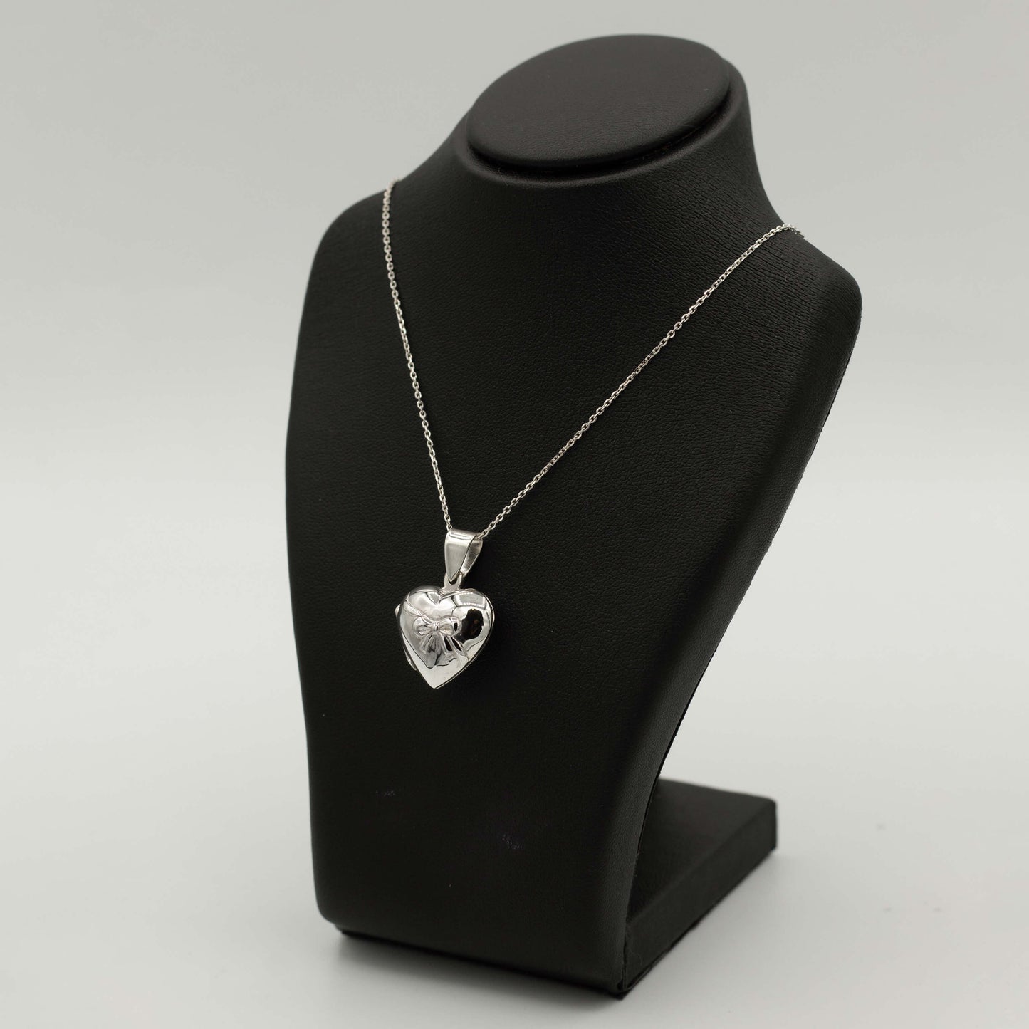 Ella: Heart-shaped locket with bow