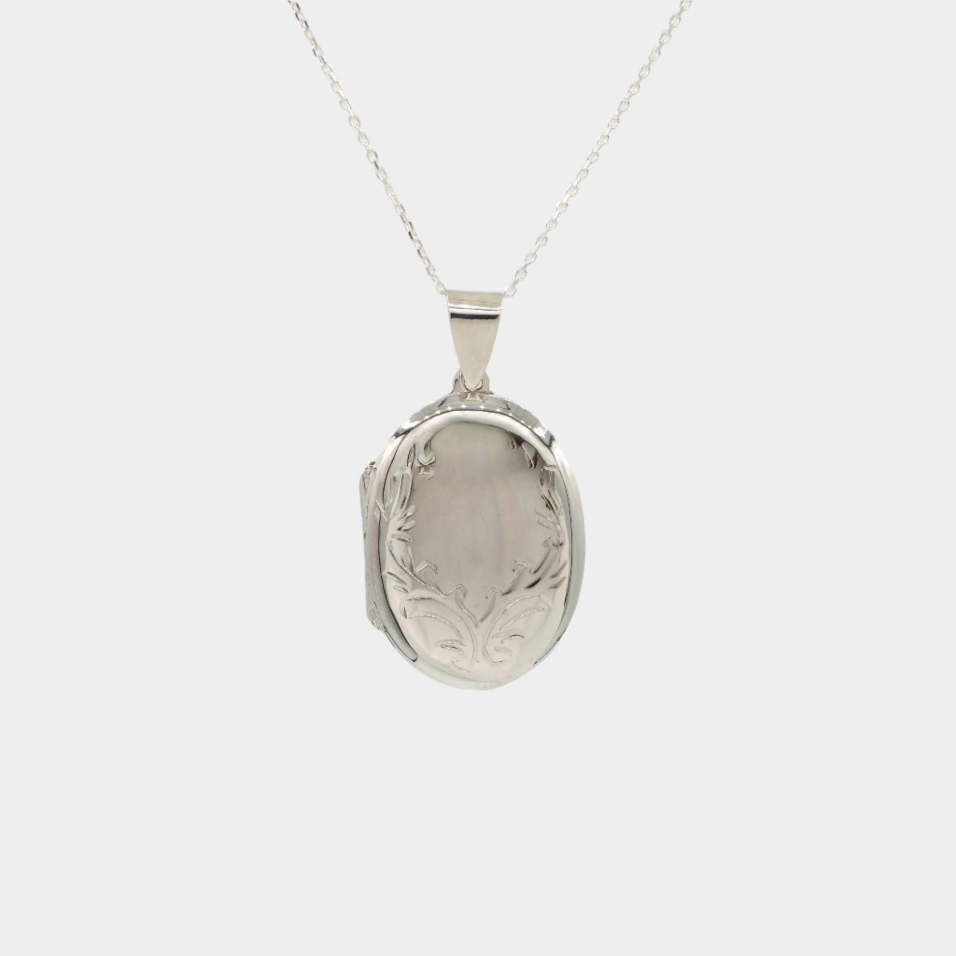 round oval large sterling silver locket with delicate design