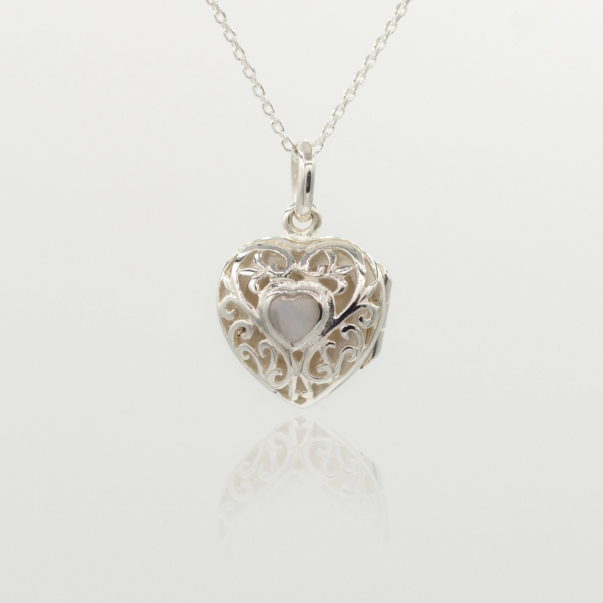sterling silver heart locket with white heart inside