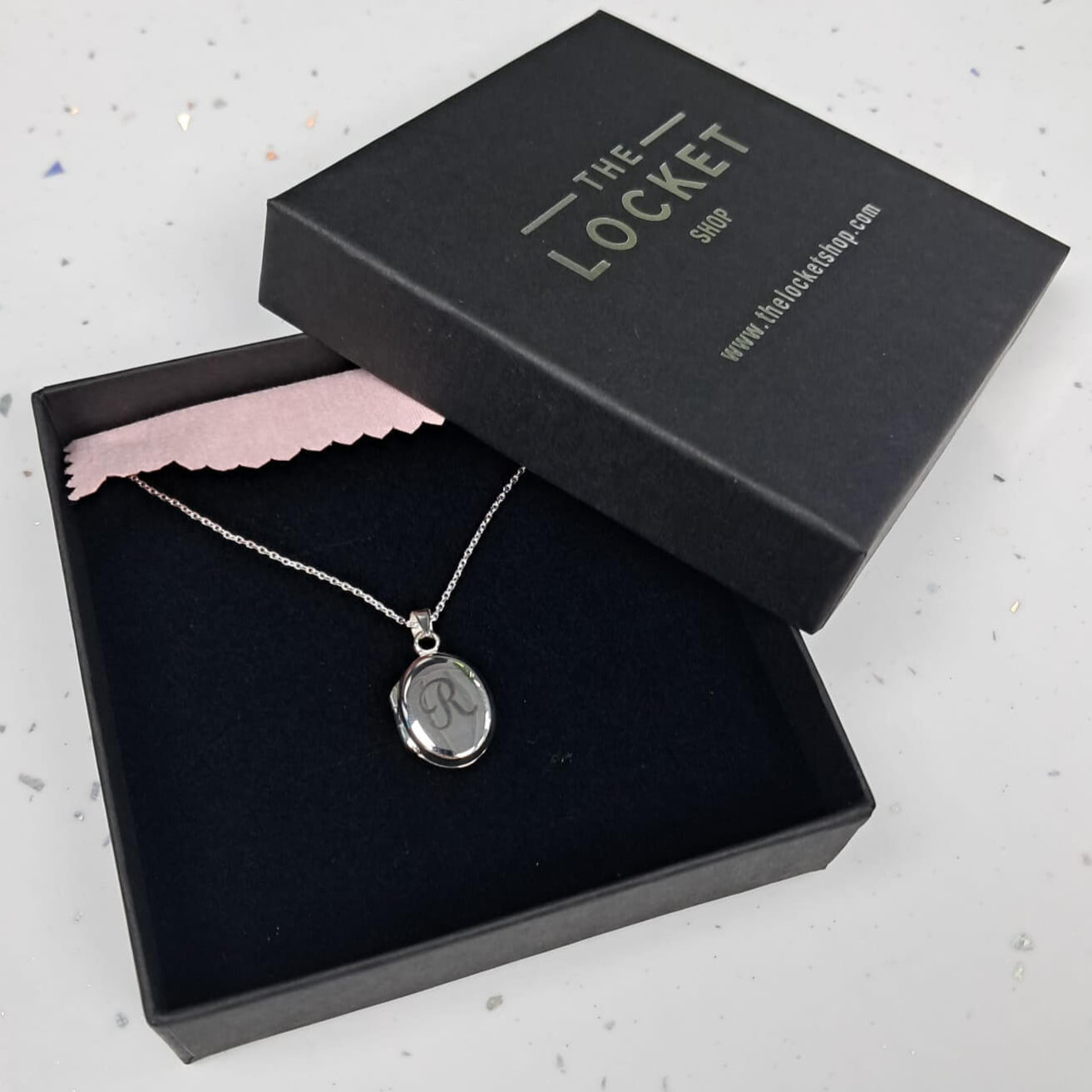 Petite silver oval locket with engraving 