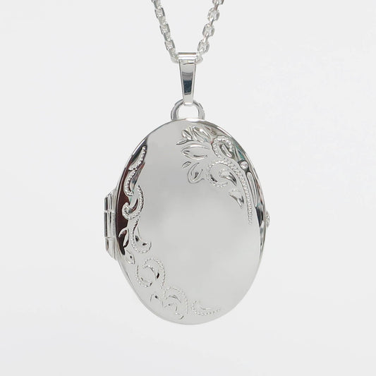 large sterling silver photo locket on a white background