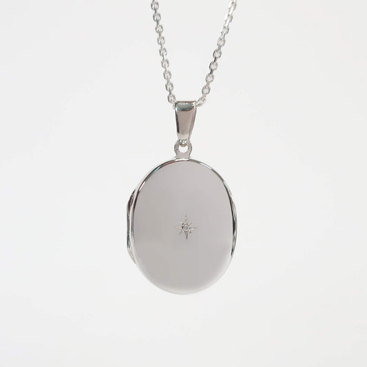 silver locket with white background