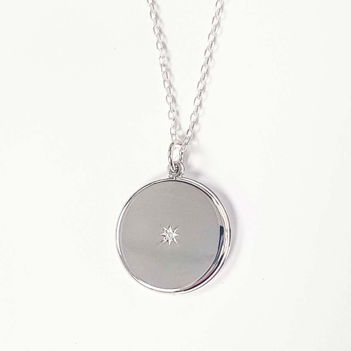 Round circular locket with cubic zirconia inset