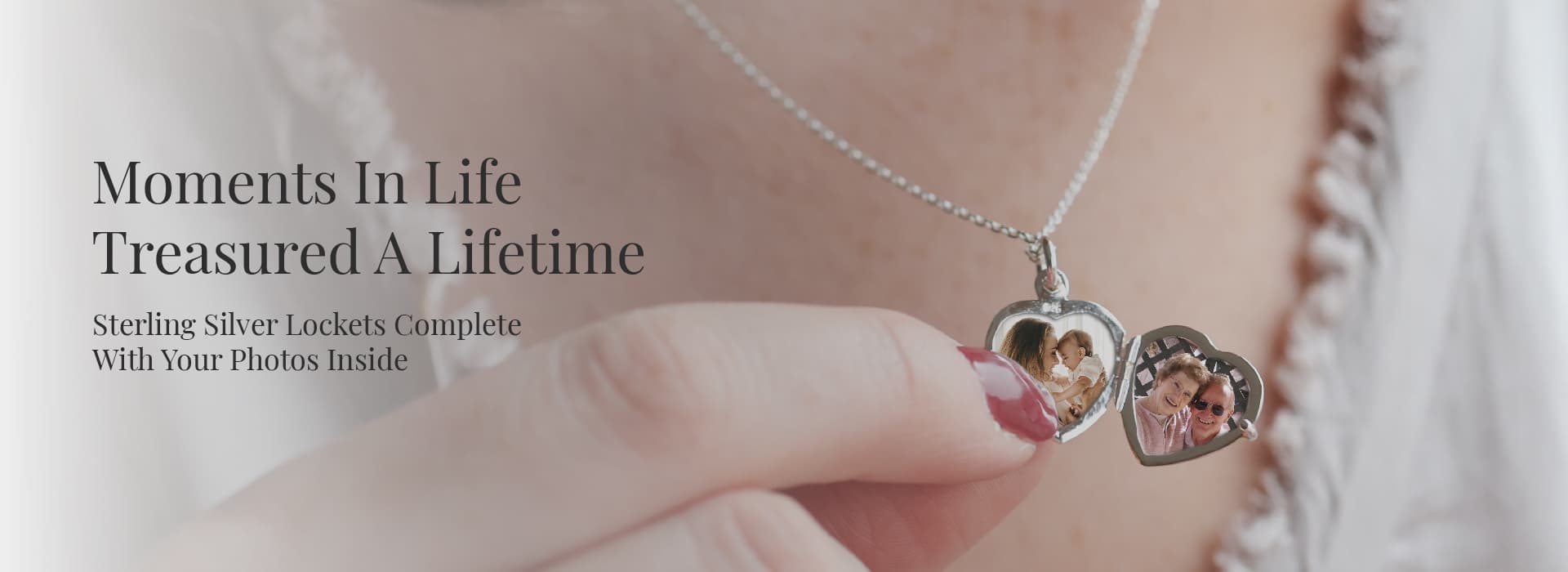 Model holding a sterlig silver heart shaped locket from the Locket Shop 