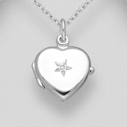 Heart shaped silver locket with star embellishment and white diamond
