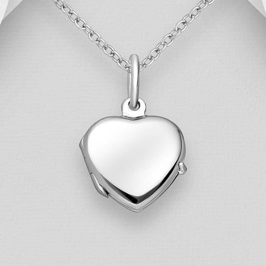 Small silver heart shaped photo necklace on a white background