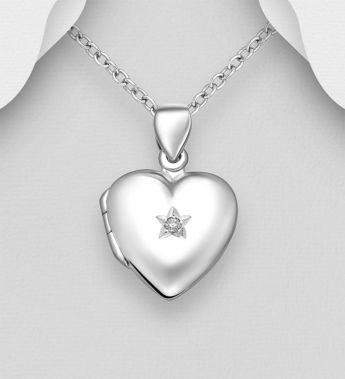 heart shaped silver photo locket with Cubic zirconia stone on a white background