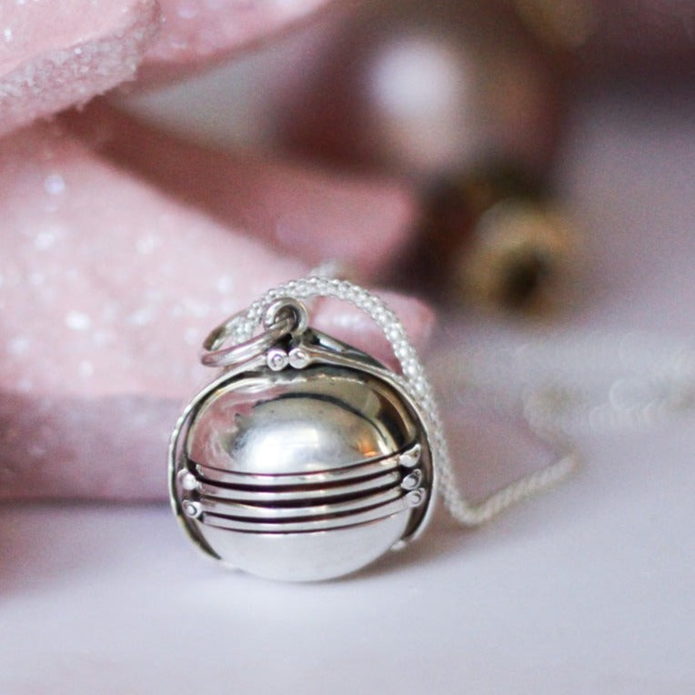 ball shaped locket and pink sparkly tree