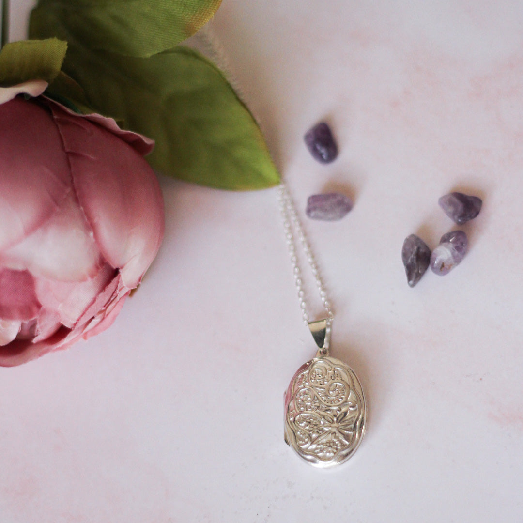Ornate Oval Silver photo locket necklace with pink background and flowers